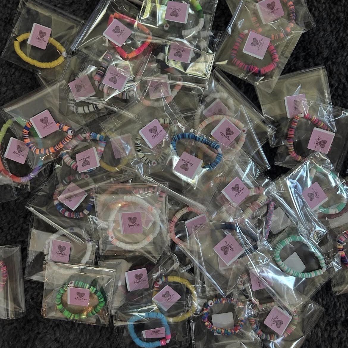 Packaged Happy Piece bracelets ready to donate